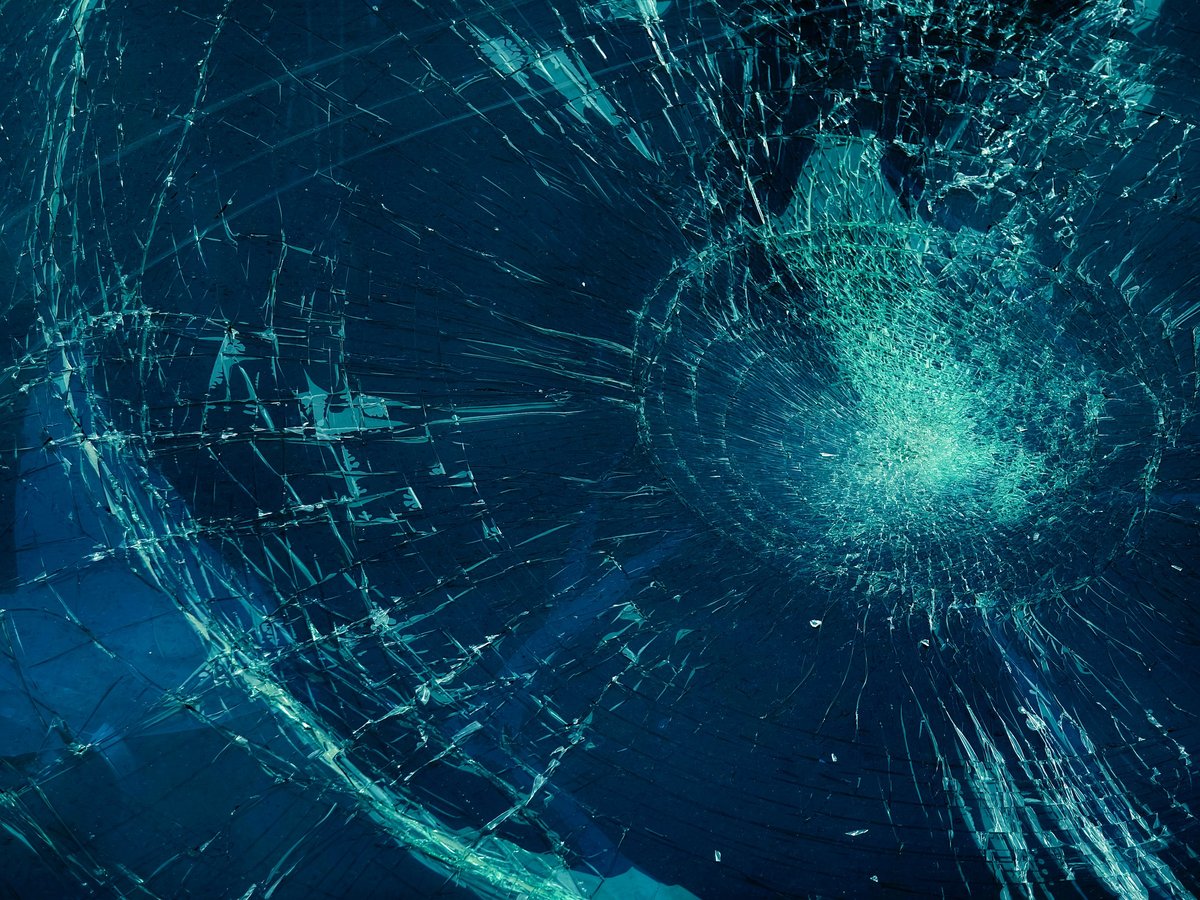 Shattered windscreen on a red car