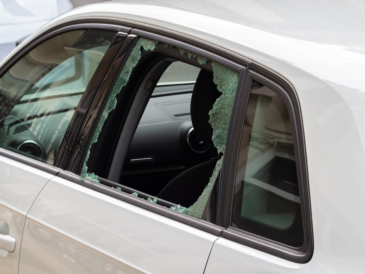 Shattered side window glass inside a vehicle